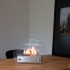Hippe biohaard met rond glas en een stalen brander. Brandtijd 2-3 uur. Maat H: 28 x B: 35 x D: 12 cm.
