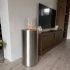 ScandiFlames Dualis bio-ethanolhaard met een frame van geborsteld staal en cilindrisch veiligheidsglas.